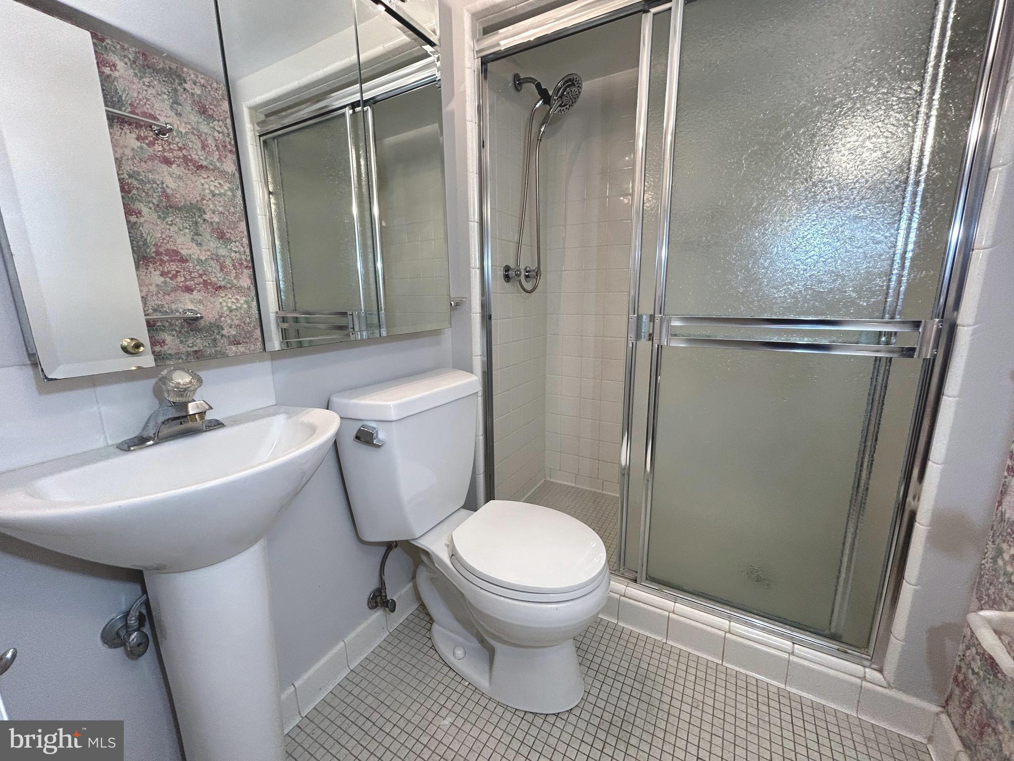 851 Canal Drive McLean, VA 22102 - Photo 30 of 50 a bathroom with a sink toilet and shower