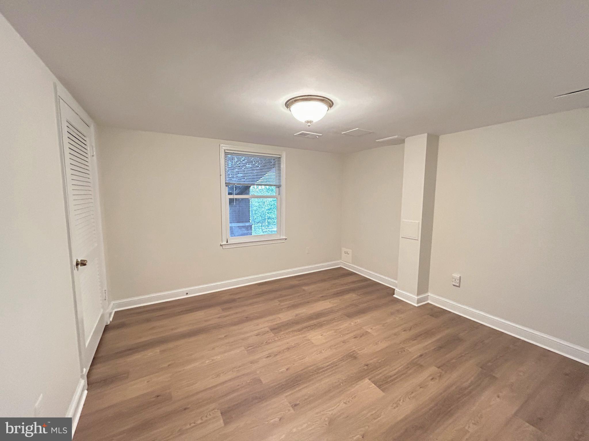 851 Canal Drive McLean, VA 22102 - Photo 31 of 50 an empty room with wooden floor and windows