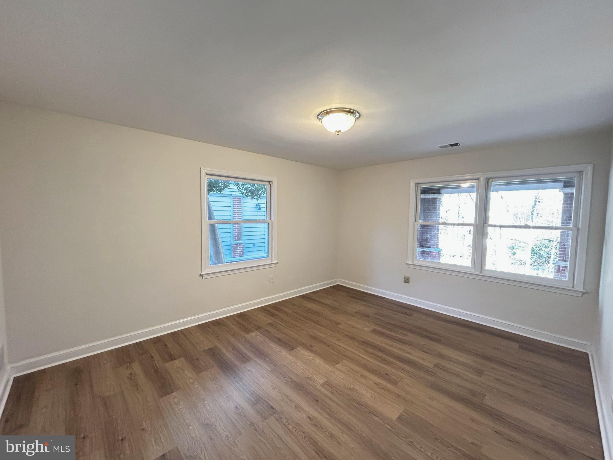 851 Canal Drive McLean, VA 22102 - Photo 32 of 50 an empty room with wooden floor and windows