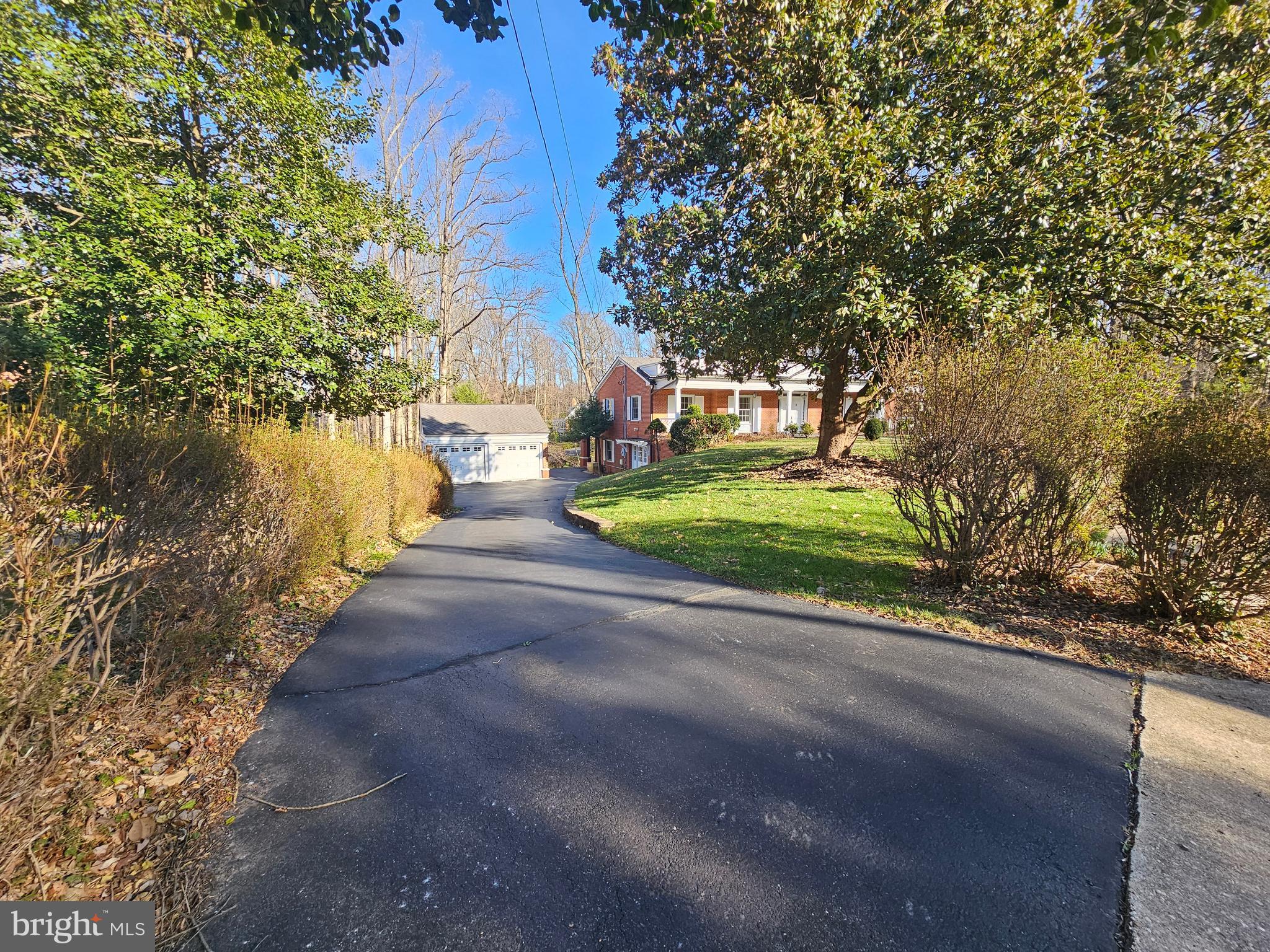 851 Canal Drive McLean, VA 22102 - Photo 40 of 50 a view of a street with a bench and trees
