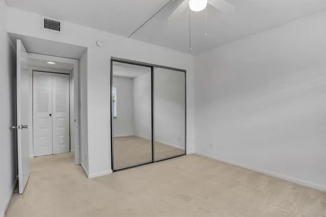 an empty room with fan