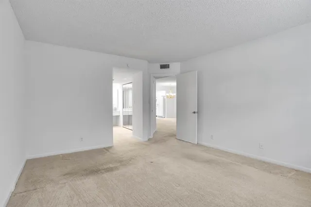 a large bathroom with a double vanity sink and mirror with bathtub