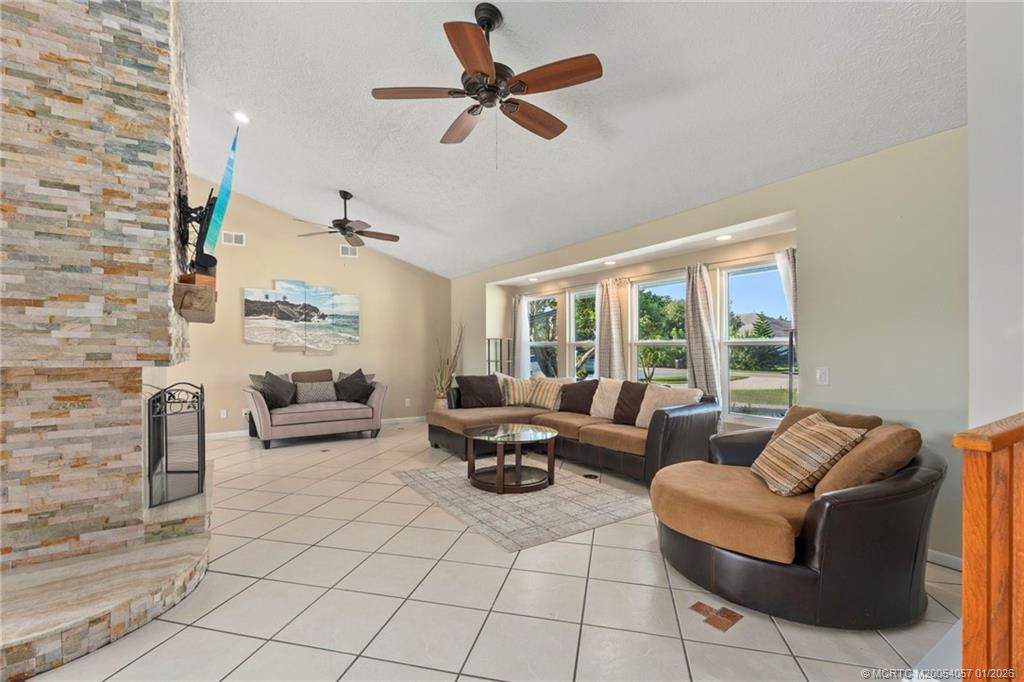 4599 Southeast Halston Court Stuart, FL 34997 - Photo 13 of 65 a living room with furniture and a large window