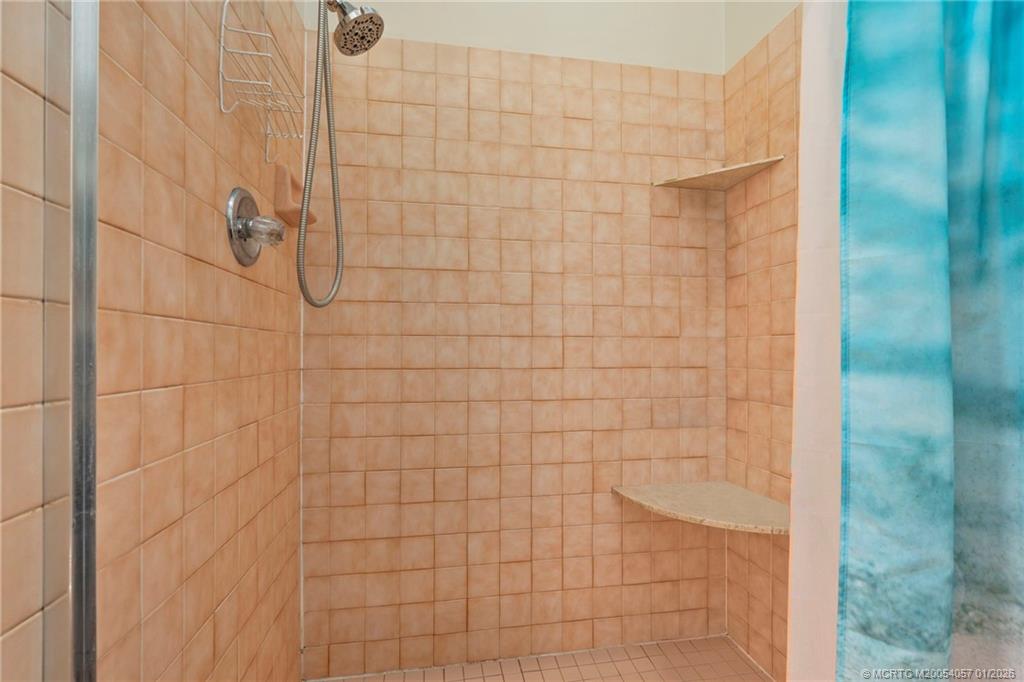 4599 Southeast Halston Court Stuart, FL 34997 - Photo 39 of 65 a bathroom with a shower