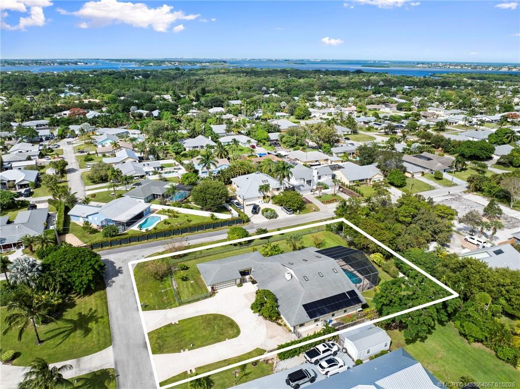 4599 Southeast Halston Court Stuart, FL 34997 - Photo 61 of 65 an aerial view of residential houses with outdoor space and river