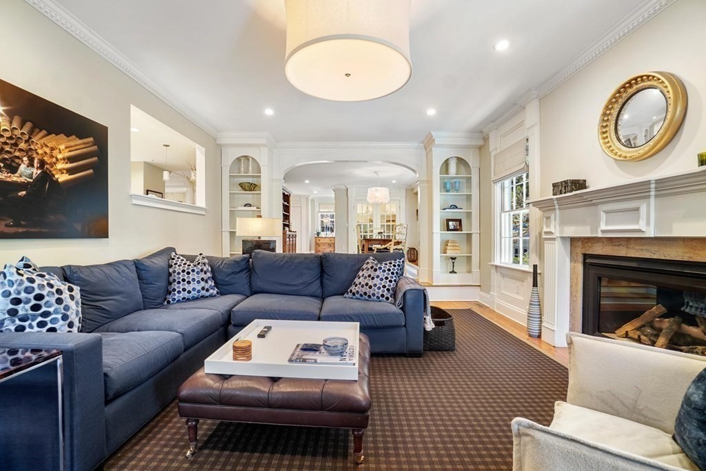 29 Whiting Road Wellesley, MA 02481 - Photo 13 of 36 a living room with furniture a fireplace and a flat screen tv