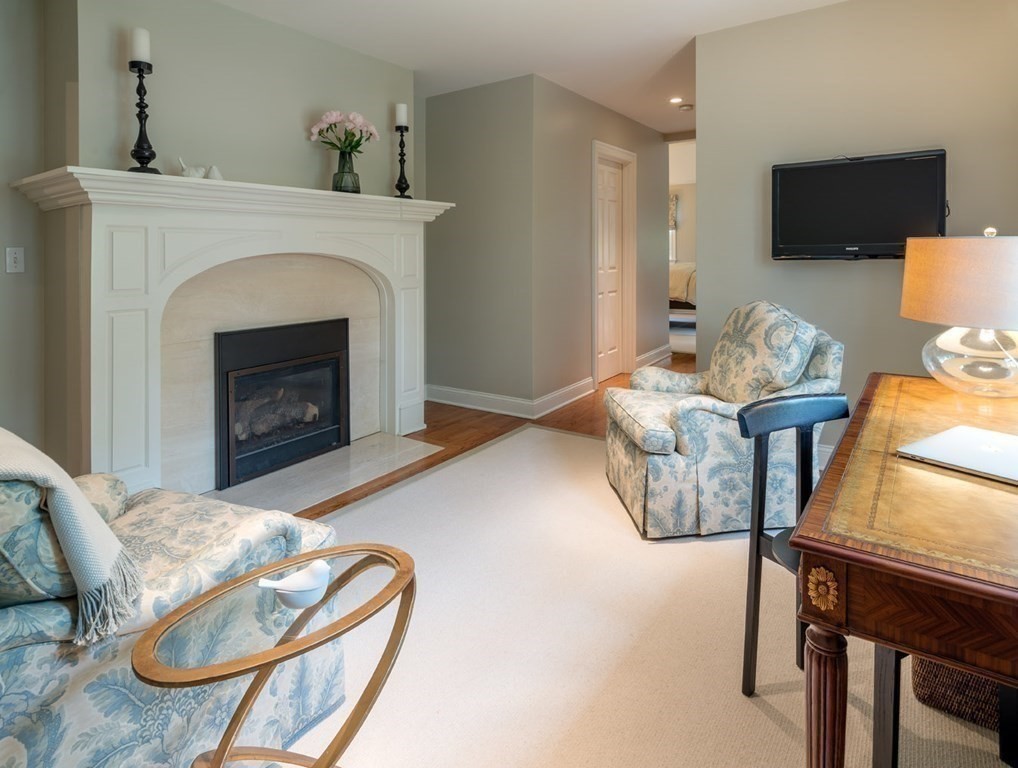 29 Whiting Road Wellesley, MA 02481 - Photo 16 of 36 a living room with furniture a flat screen tv and a fireplace