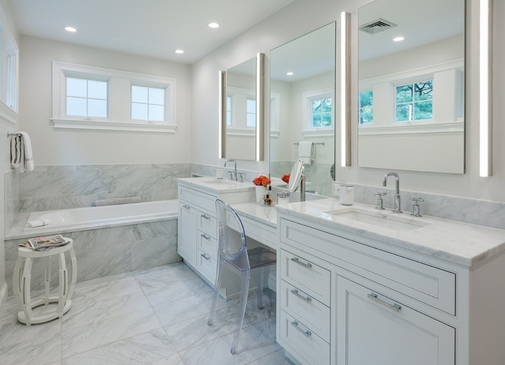 29 Whiting Road Wellesley, MA 02481 - Photo 19 of 36 a bathroom with a sink double vanity granite tub shower and a mirror