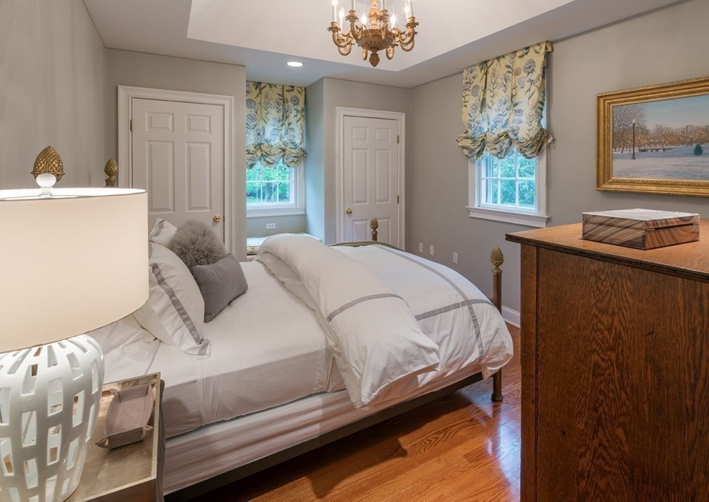 29 Whiting Road Wellesley, MA 02481 - Photo 22 of 36 a bed sitting in a bedroom next to a window