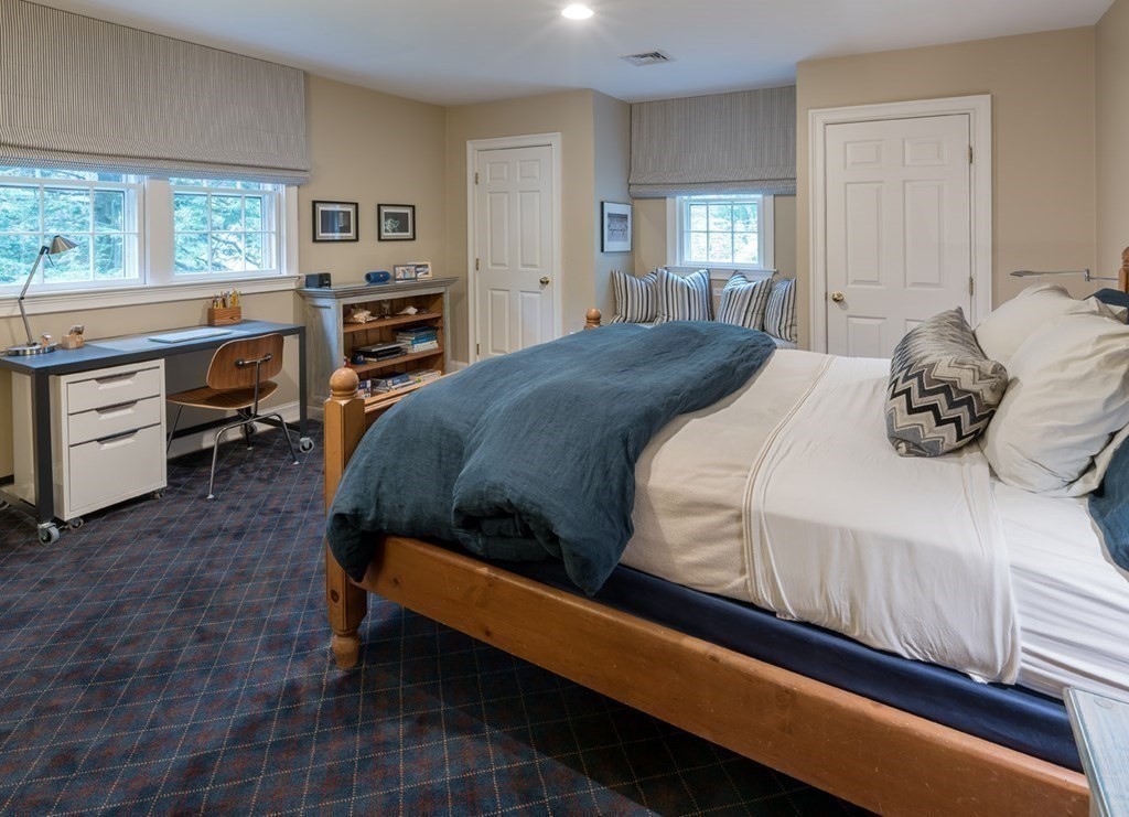 29 Whiting Road Wellesley, MA 02481 - Photo 23 of 36 a bedroom with a bed and a dresser