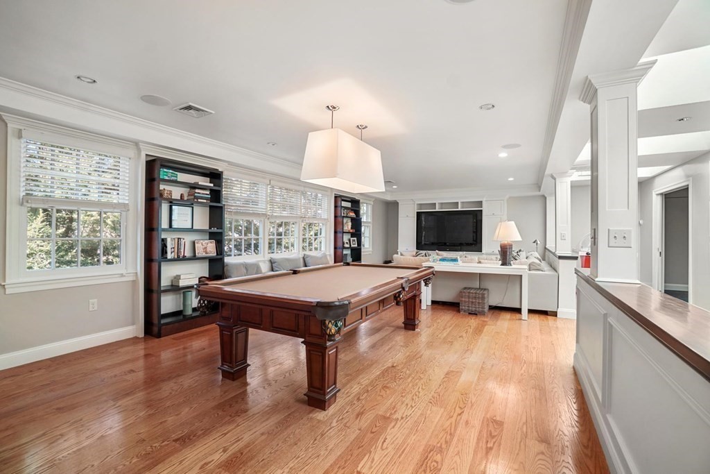 29 Whiting Road Wellesley, MA 02481 - Photo 27 of 36 a living room with furniture a flat screen tv and a table