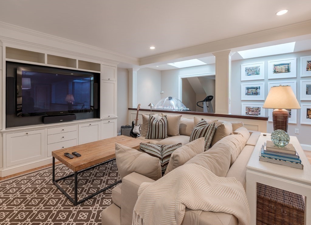 29 Whiting Road Wellesley, MA 02481 - Photo 29 of 36 a living room with furniture and a flat screen tv