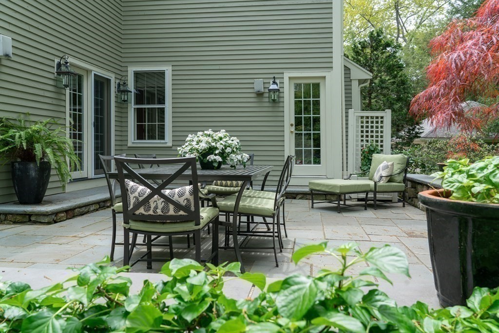 29 Whiting Road Wellesley, MA 02481 - Photo 35 of 36 a view of a chairs and table in the back yard of the house