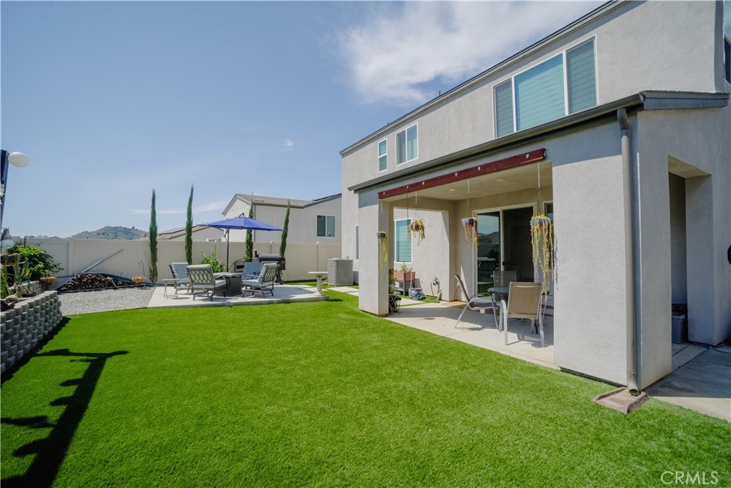 35323 Orchard Trail Fallbrook, CA 92028 - Photo 24 of 30 a view of a house with backyard porch and sitting area