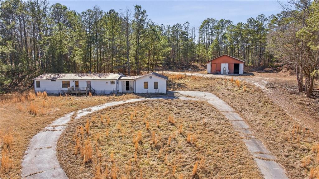 3004 Candler Road Gainesville, GA 30507 - Photo 24 of 27 a view of a house with a yard and trees