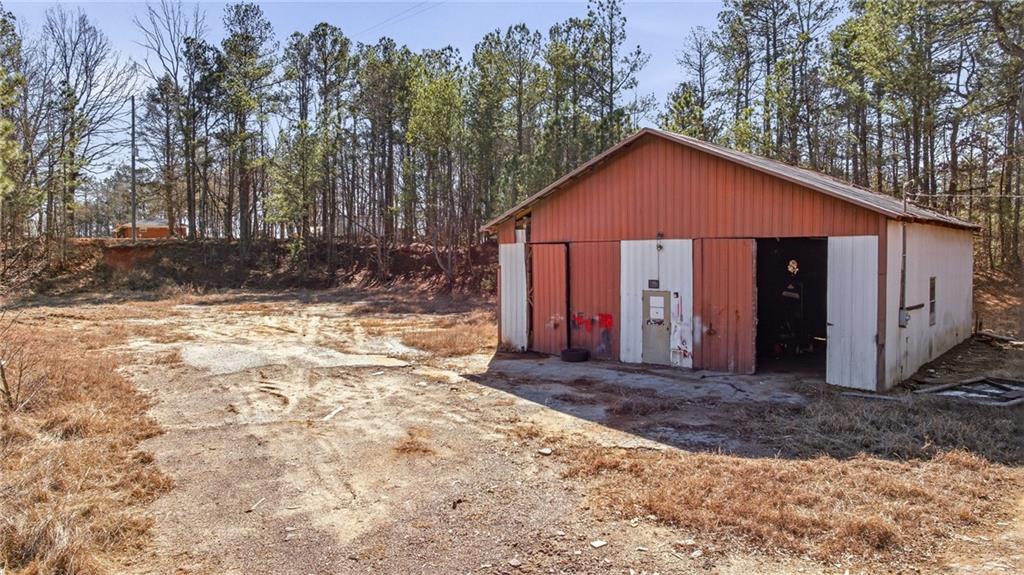 3004 Candler Road Gainesville, GA 30507 - Photo 26 of 27 a view of a house with a yard covered in snow