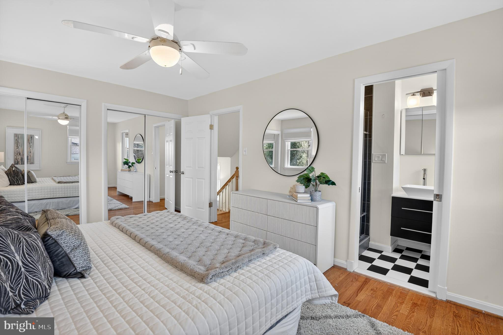 11004 Oakwood Street Silver Spring, MD 20901 - Photo 19 of 35 a bedroom with a bed and a chandelier
