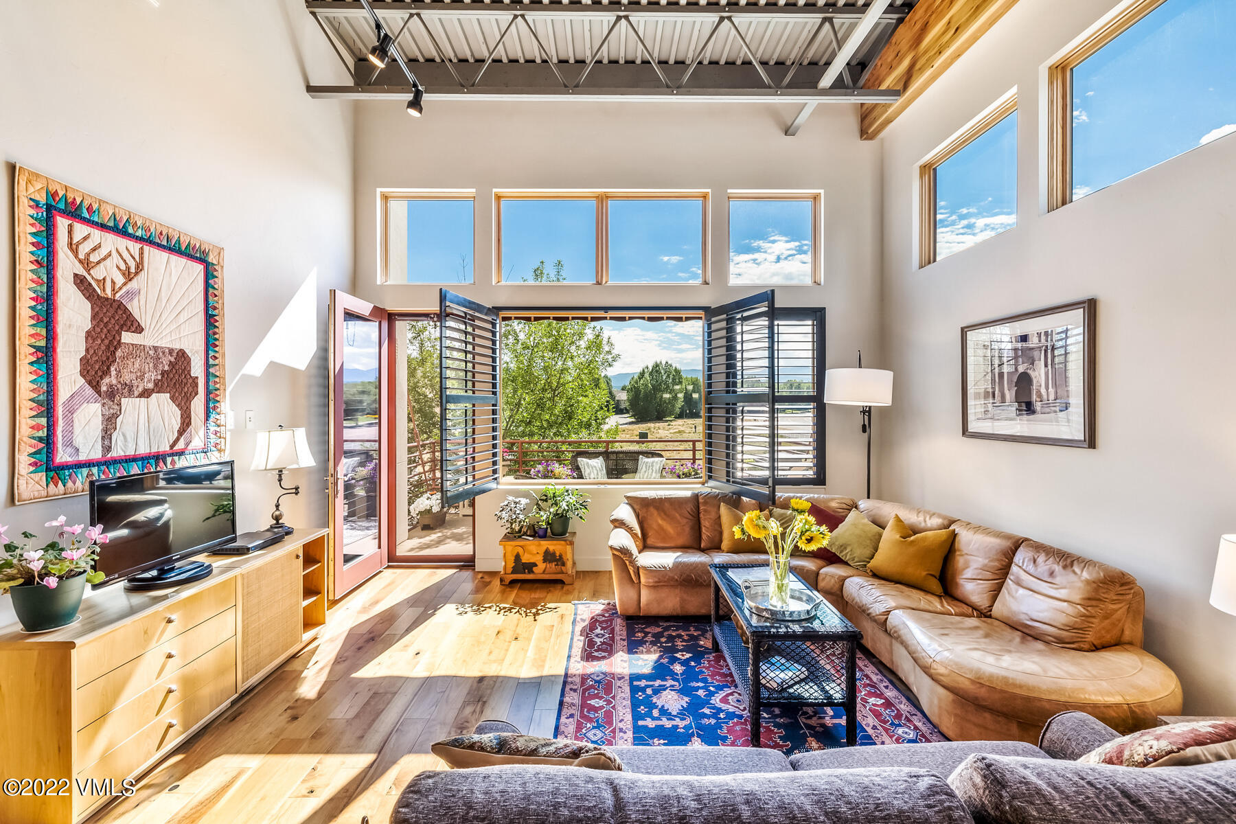 1185 Capitol Street, Unit 203 Eagle, CO 81631 - Photo 2 of 22 a living room with furniture and a large window