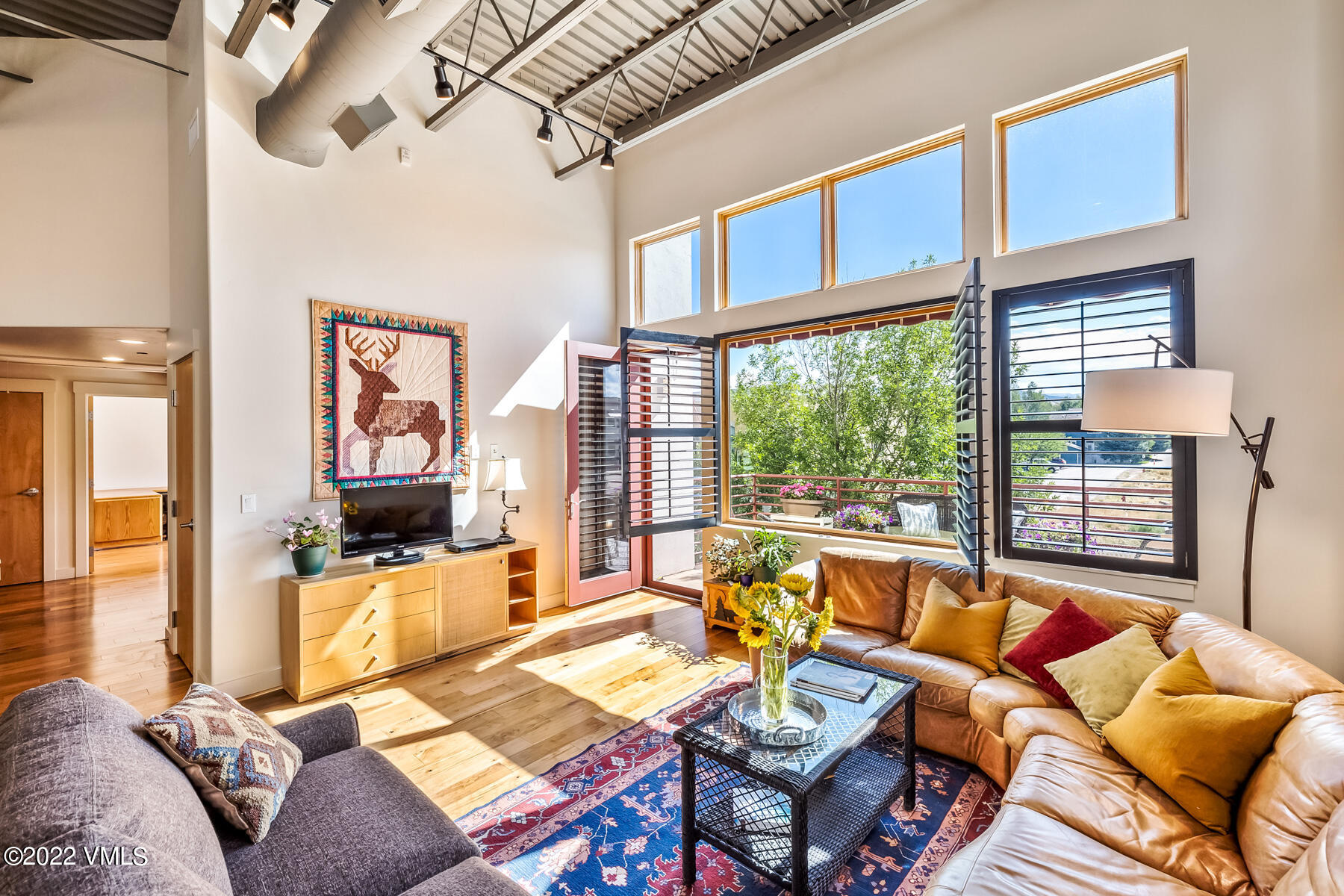 1185 Capitol Street, Unit 203 Eagle, CO 81631 - Photo 4 of 22 a living room with furniture and a flat screen tv