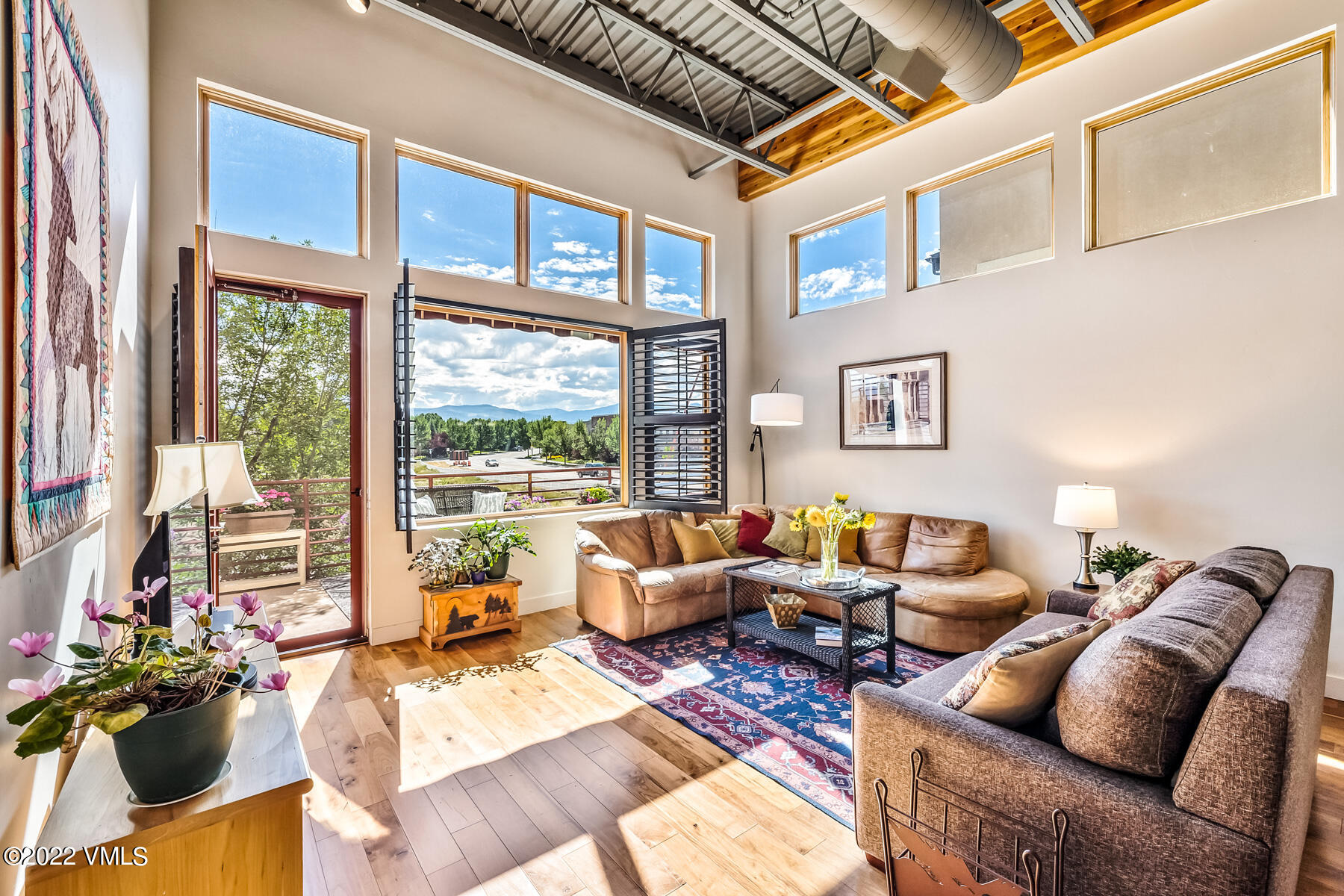 1185 Capitol Street, Unit 203 Eagle, CO 81631 - Photo 5 of 22 a living room with furniture or couch and a large window