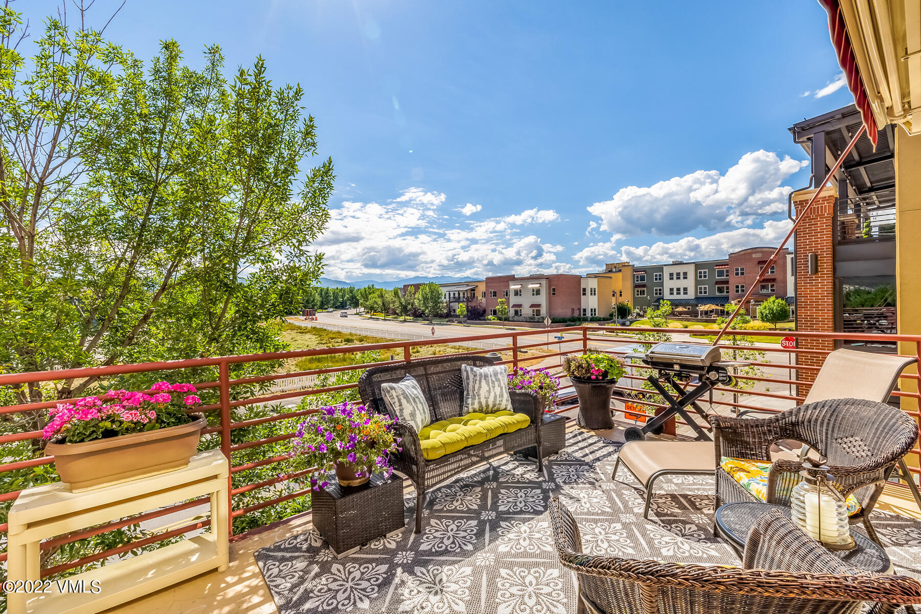 1185 Capitol Street, Unit 203 Eagle, CO 81631 - Photo 8 of 22 a view of a patio with table and chairs potted plants