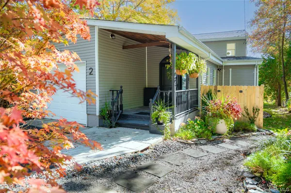 a view of a potted plants in front of a house
