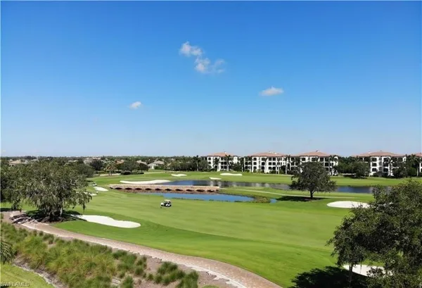 a living room with couch and a floor to ceiling window
