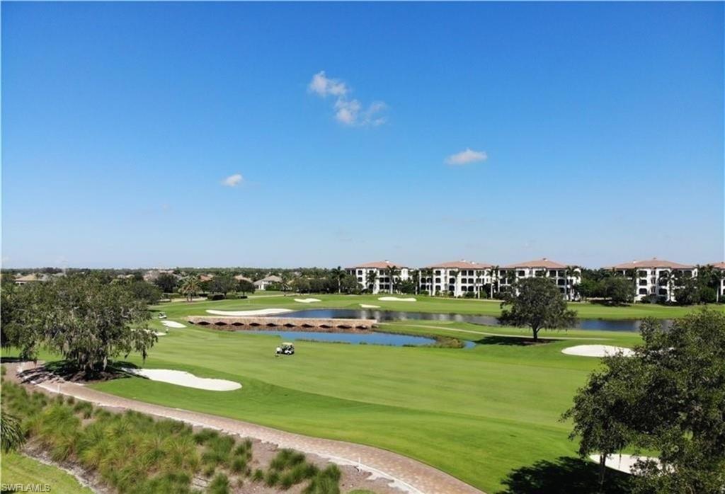 16391 Viansa Way, Unit 101 Naples, FL 34110 - Photo 16 of 49 a view of a city with lots of residential buildings and ocean view