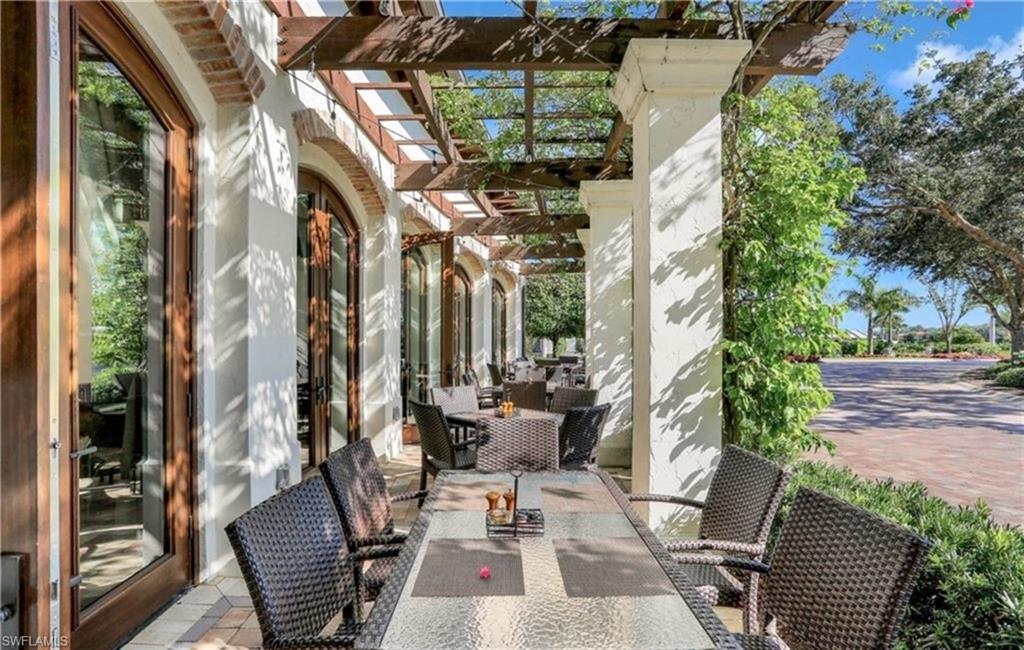 16391 Viansa Way, Unit 101 Naples, FL 34110 - Photo 42 of 49 a view of patio with couple of couch and chairs