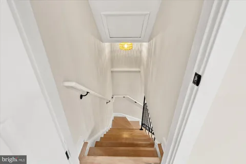 a view of staircase with white walls