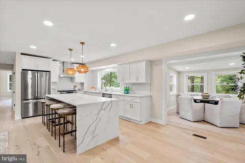 a kitchen with a sink stainless steel appliances and cabinets