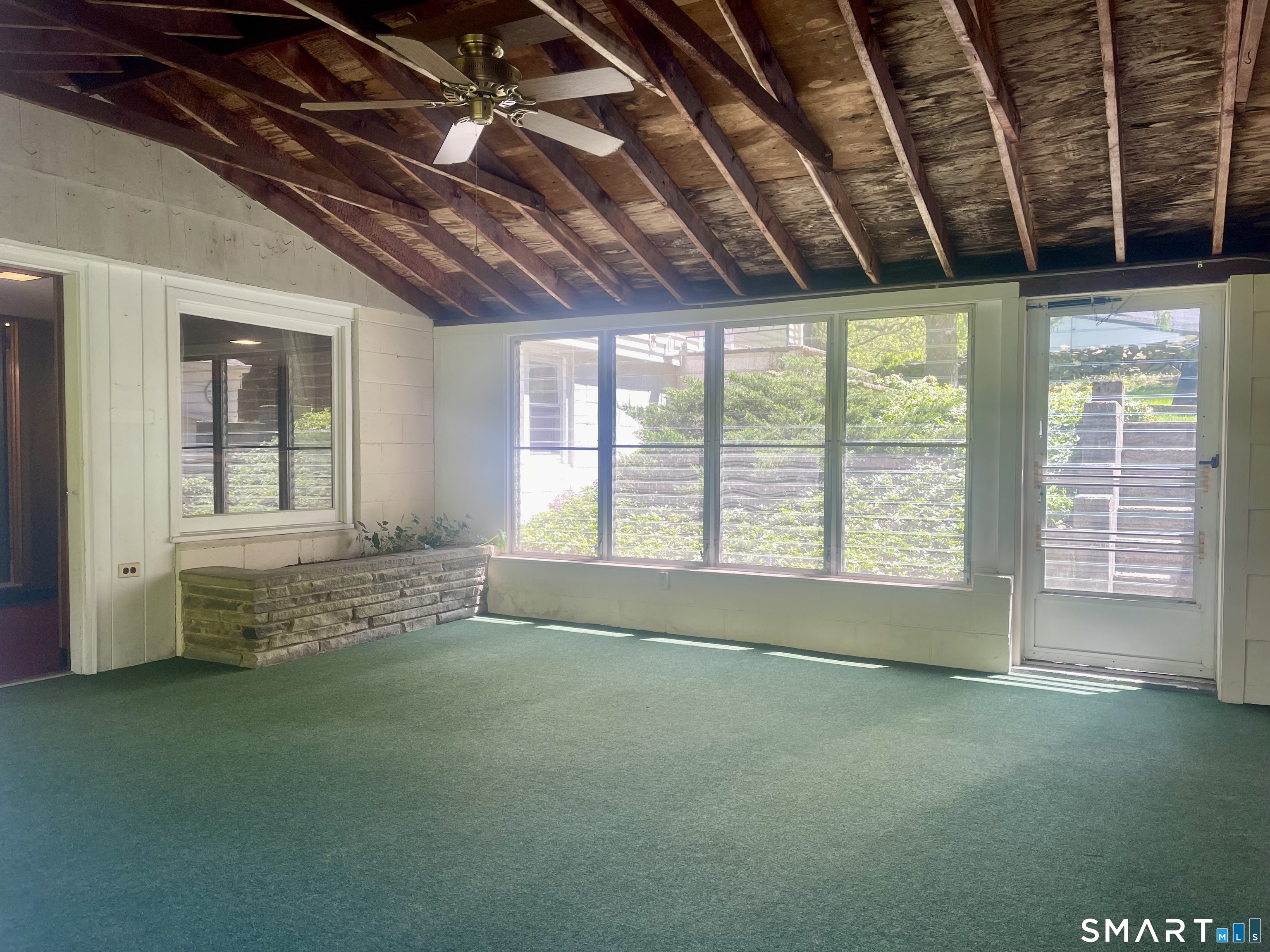 9 Apple Lane Redding, CT 06896 - Photo 7 of 39 Enclosed sunporch is between the garage and the basement entry
