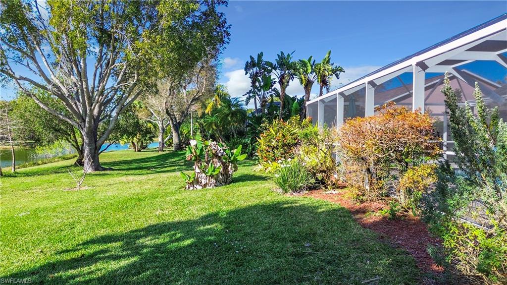 147 Plantation Circle Naples, FL 34104 - Photo 24 of 32 a view of a house with a yard