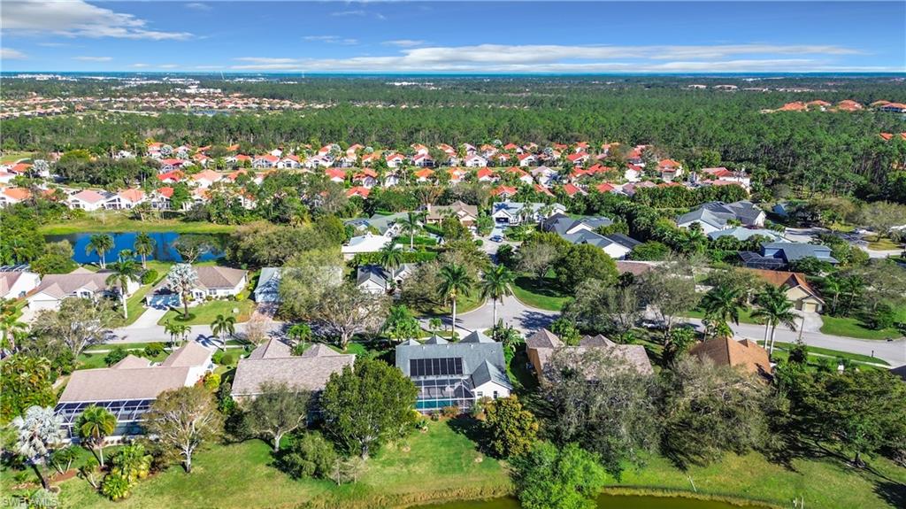 147 Plantation Circle Naples, FL 34104 - Photo 27 of 32 an aerial view of residential building and lake