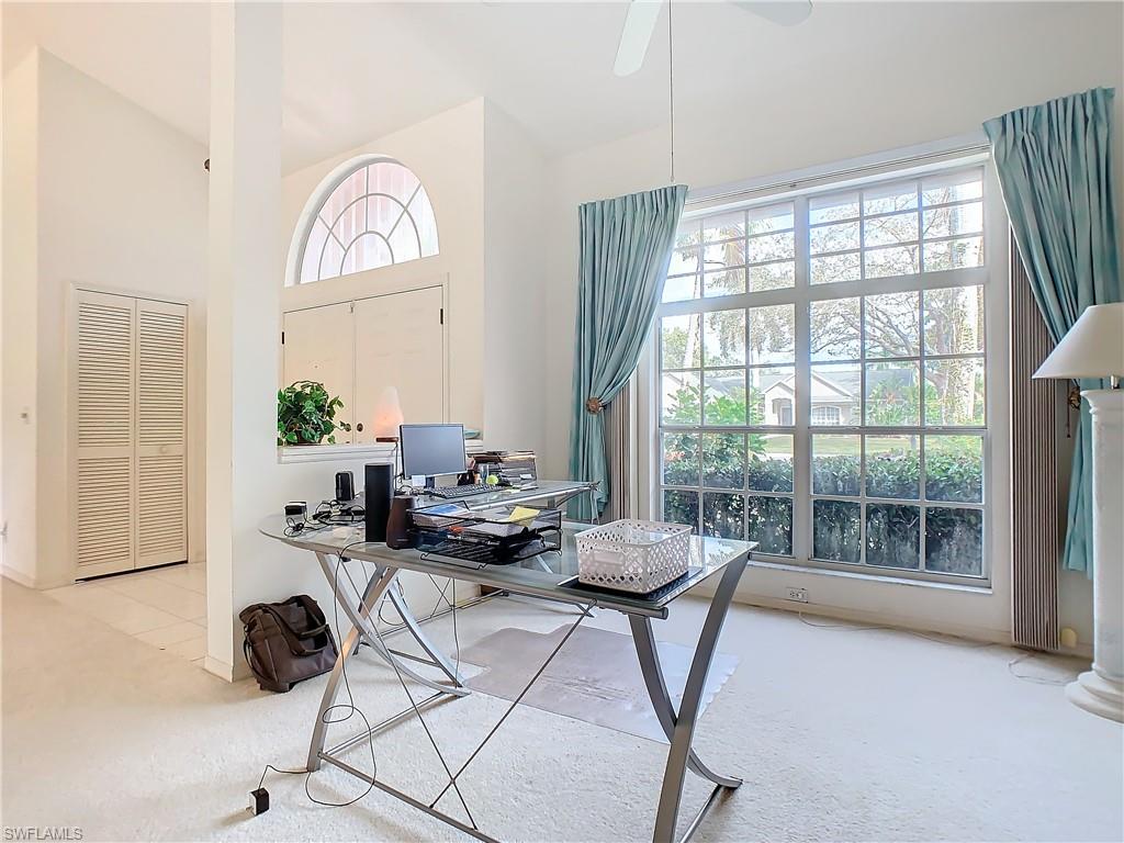 147 Plantation Circle Naples, FL 34104 - Photo 5 of 32 a view of a livingroom with furniture and a large window