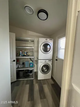a view of a storage and utility room with washer and dryer