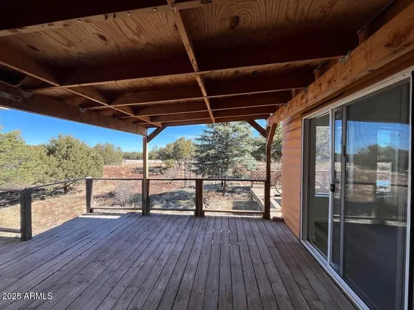 a view of outdoor space with wooden floor