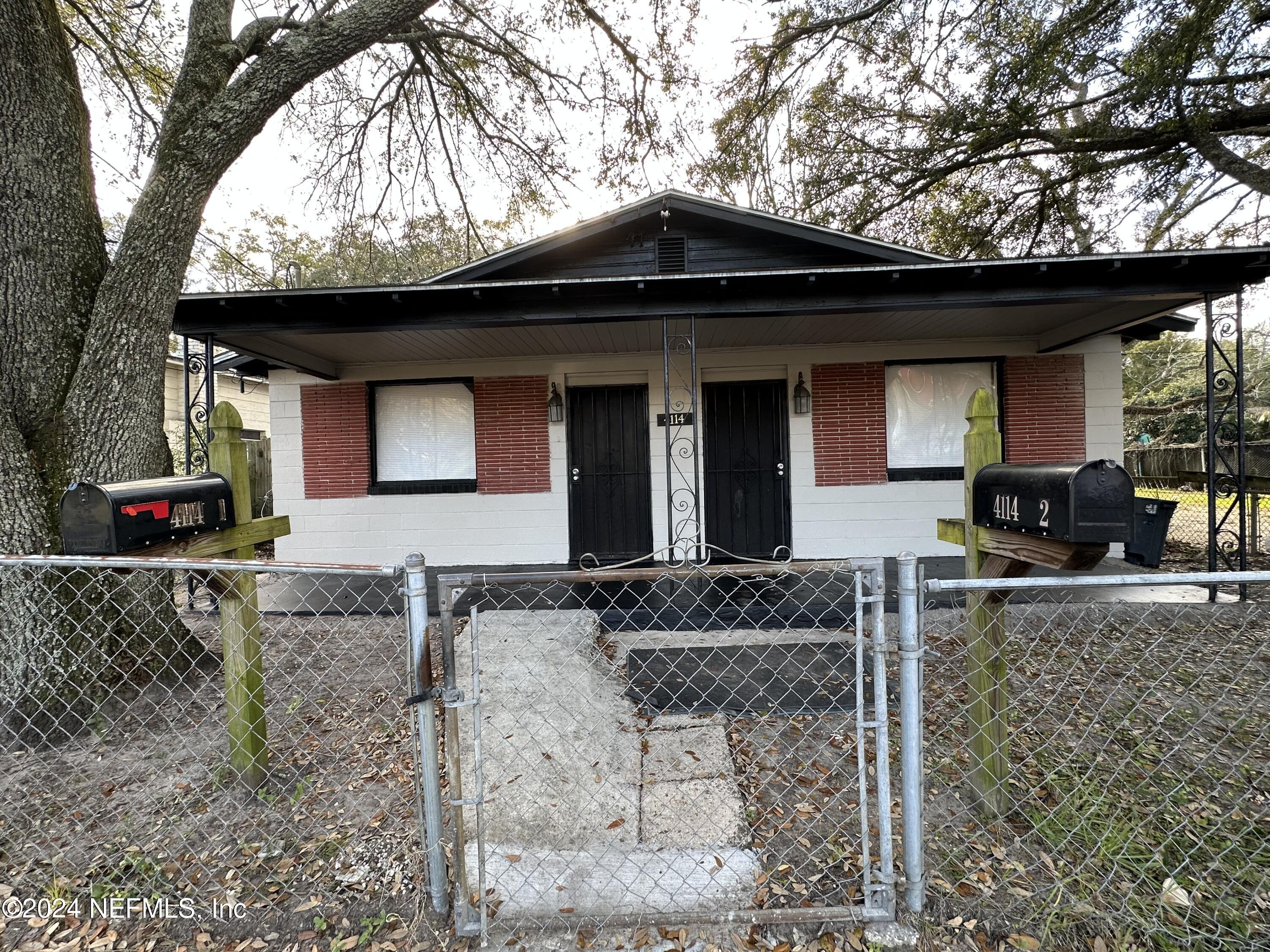 a front view of house with outdoor seating
