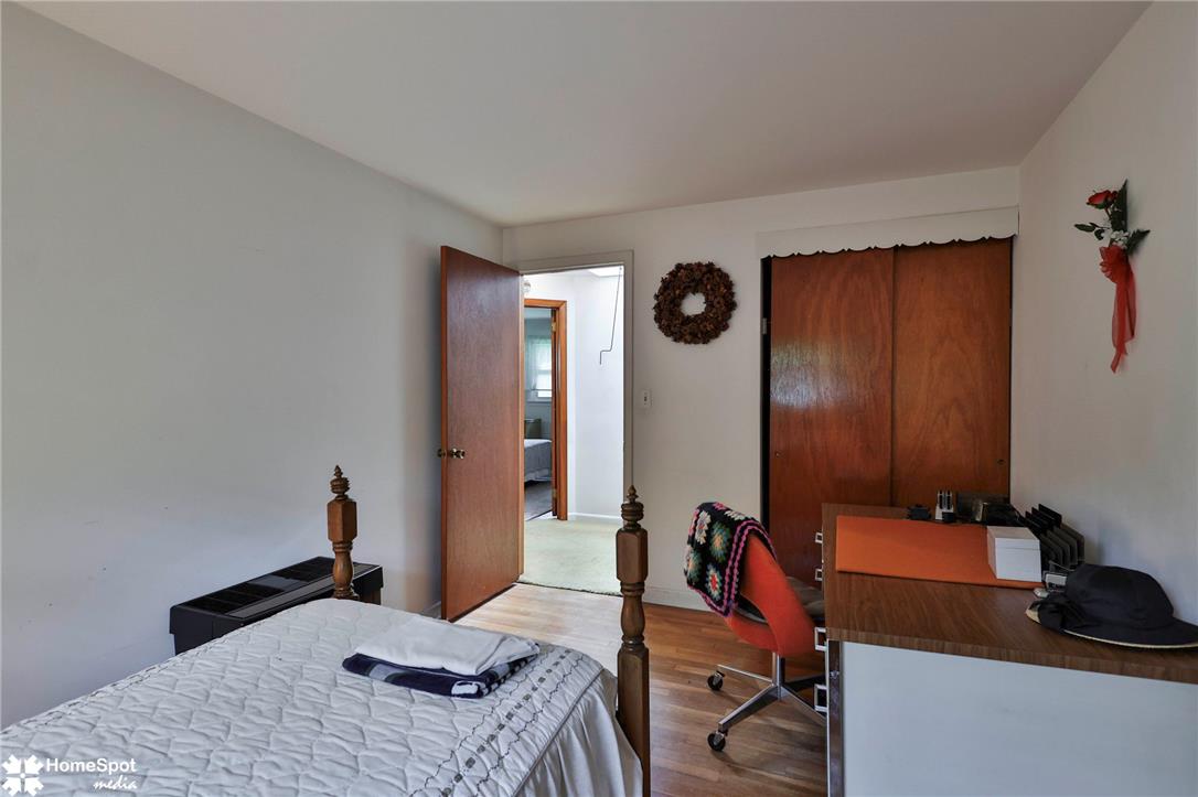 6054 Old Hickory Road Coopersburg, PA 18036 - Photo 21 of 48 Gleaming hardwood floors and a built-in closet bring classic warmth to this cozy bedroom.
