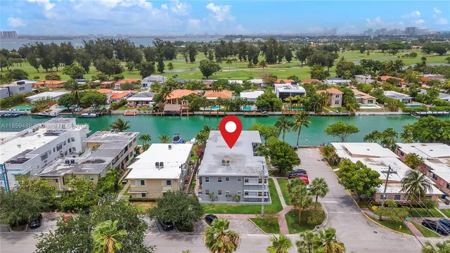 an aerial view of a house with a lake view