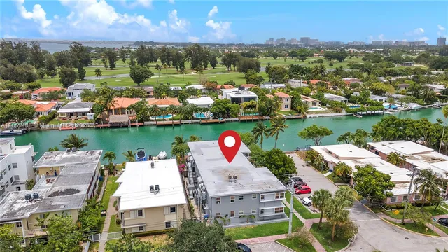 an aerial view of a house with lake view