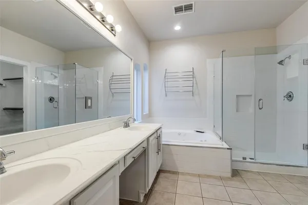 a bathroom with a granite countertop sink a toilet and shower