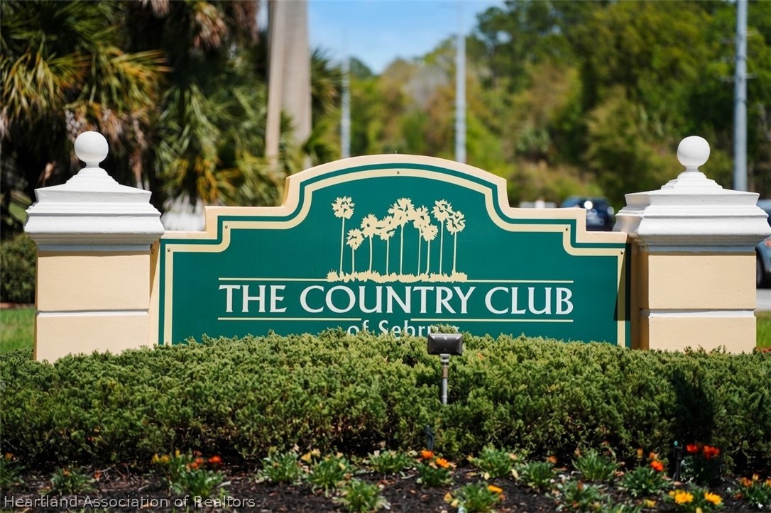 4734 Haw Branch Road, Unit 110 Sebring, FL 33875 - Photo 4 of 50 a sign that is sitting on a brick wall