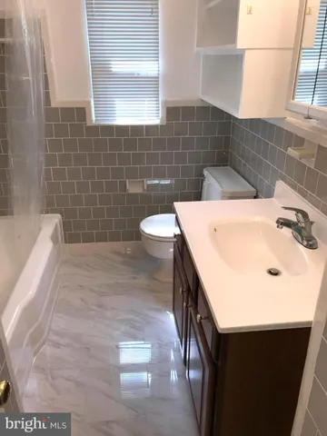 a bathroom with a sink and a bathtub