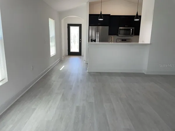 a view of a kitchen from the hallway