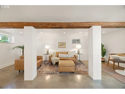 a bedroom with furniture and wooden floor