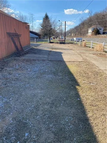 a view of a backyard of the house