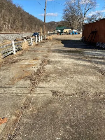 a view of a yard with an outdoor space