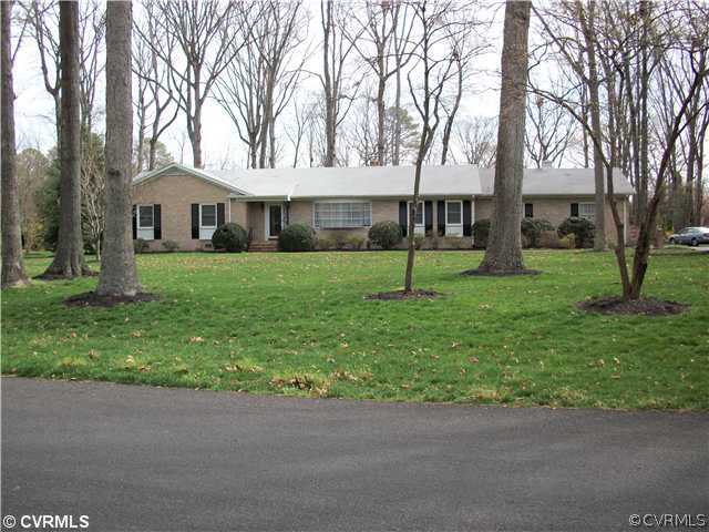 a house that has a tree in front of it