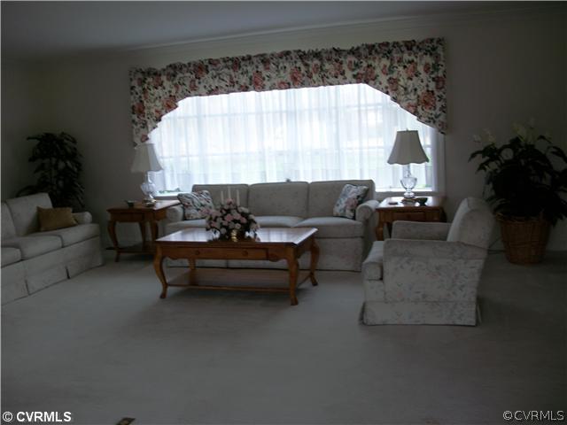 2541 Radstock Road Midlothian, VA 23113 - Photo 4 of 12 a living room with furniture and a large window